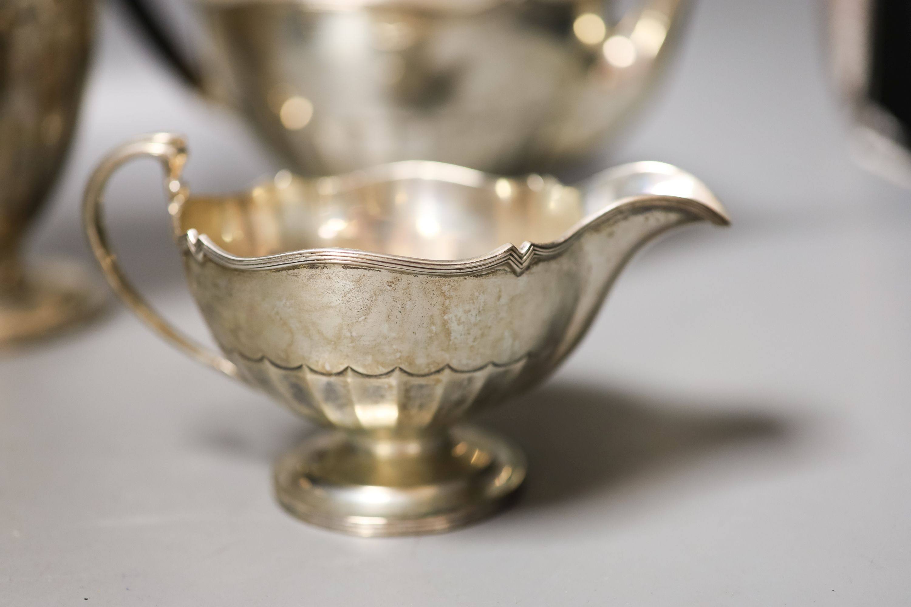A George V four piece silver circular tea set, Fenton, Russel & Co Ltd, Birmingham, 1912